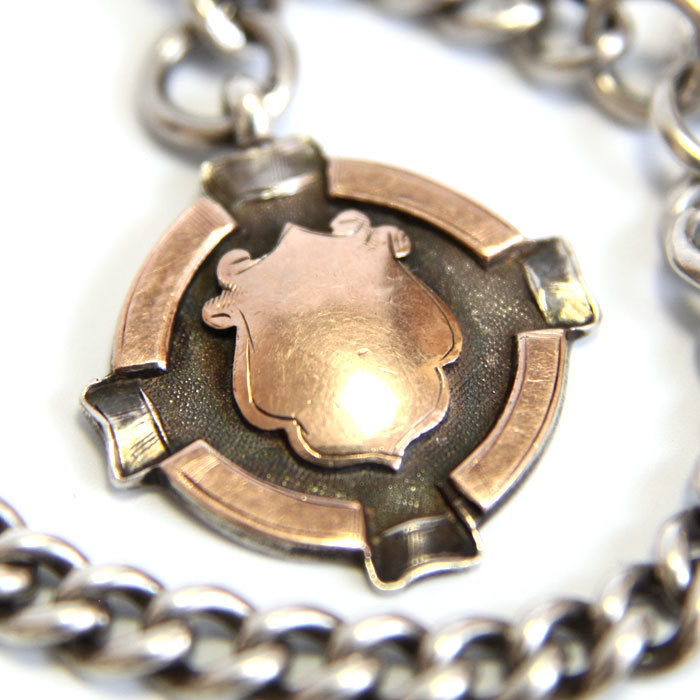 Старинная серебряная цепочка для карманных часов с золотым медальоном 37см. Европа вторая половина 19 века.