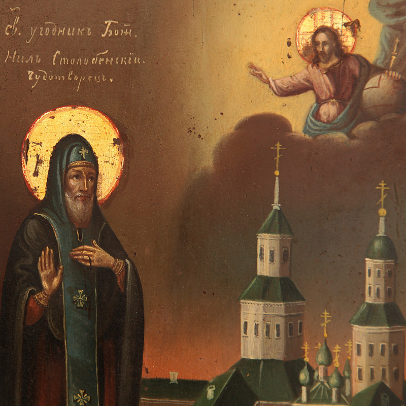 Старинная икона Святой угодник Божий преподобный Нил Столбенский Чудотворец на фоне Нило-Столобенского монастыря, в посеребренном окладе.