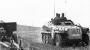 На передней части кузова бронетранспортёра нанесен тактический знак батареи самоходных гаубиц и эмблема второй танковой дивизии